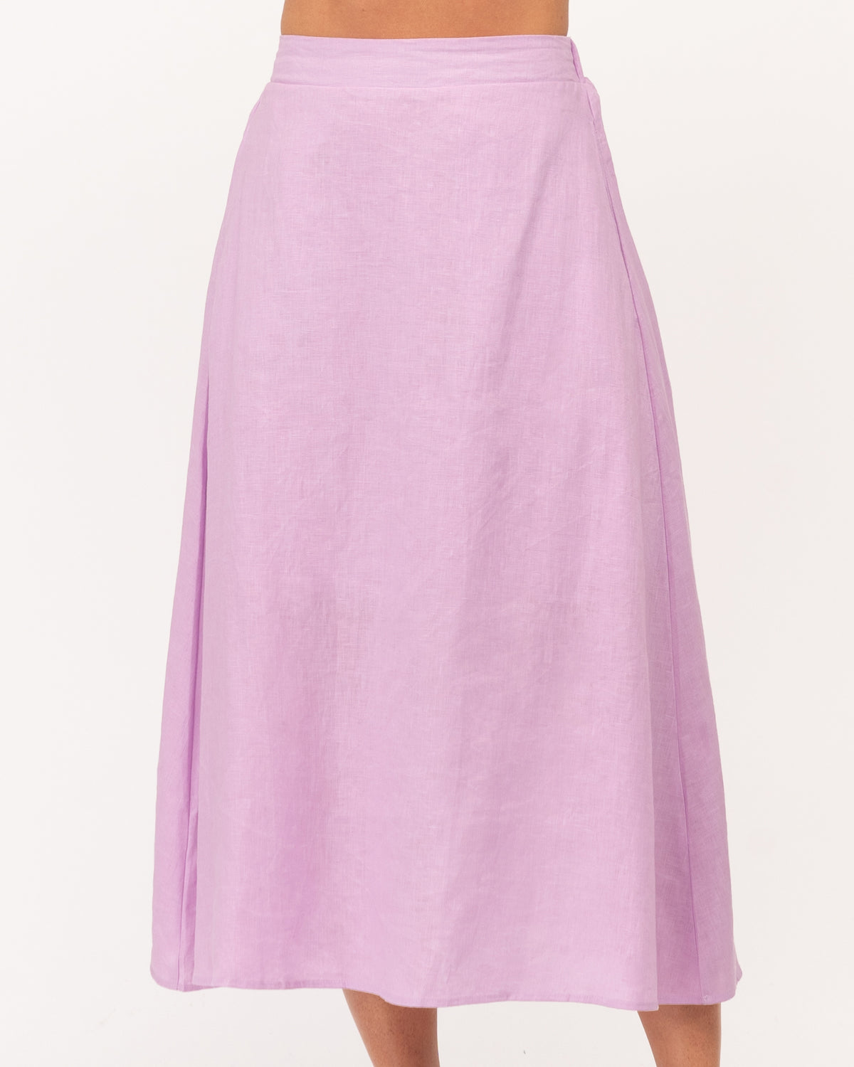 A girl wearing a purple linen maxi skirt with a matching top from the Ebby and I collection designed by Global Fashion House. 
